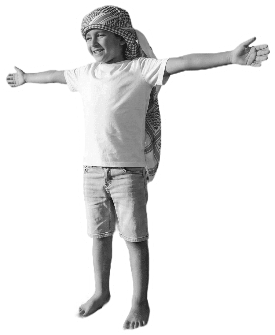 A child in a ghutra with arms thrown wide